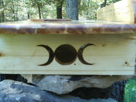 Goddess Symbol Scrolled Into The Right Leg of this Wiccan Altar