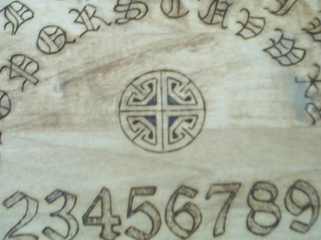 Celtic symbols, old english letters, and numbers including a celtic wheel